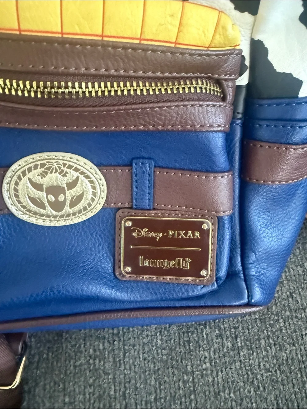 Loungefly Disney Pixar Woody Mini Backpack – Blue, Brown, Yellow